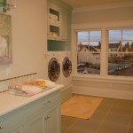 laundry room with metal tile and ceramic tile backsplash