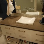 contemporary sink and counter with tile backsplash