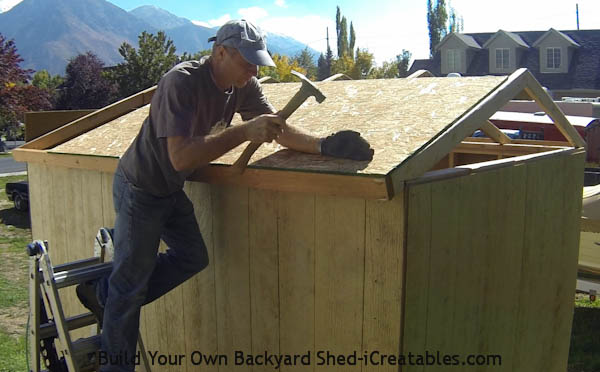 How to build a shed roof installing the first piece of roof sheeting